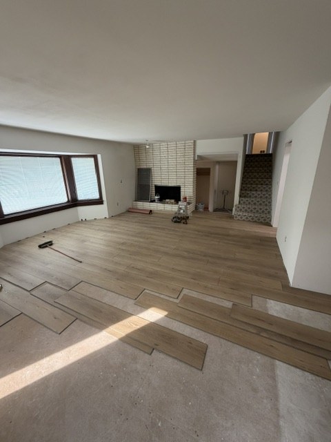 Flooring installation in progress in a living room