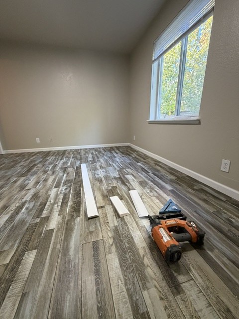 Luxury vinyl plank flooring installation in a bedroom